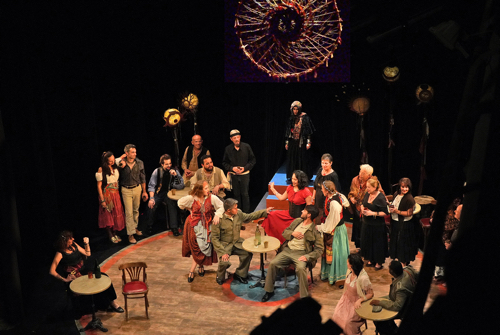 Singers on stage presenting an opera performance