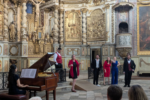 Singers performing in a Baroque church